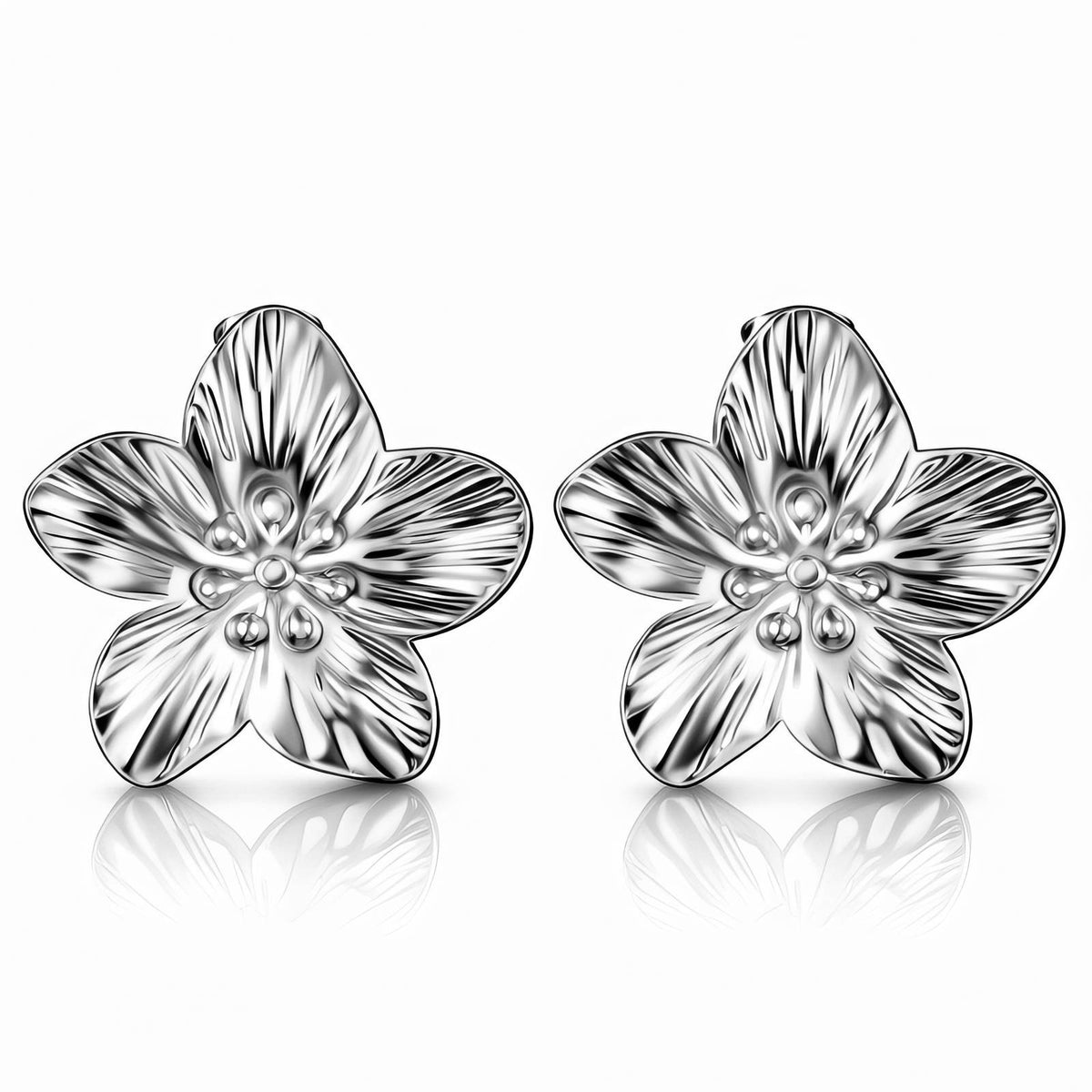 Silver-Tone Flower Studs: the pair of sculpted five-petal flowers on white, silver-tone