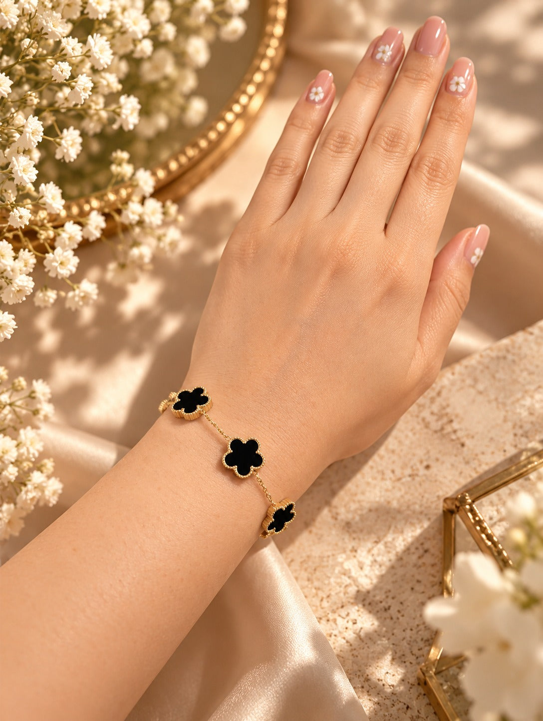 Black & White Flower Station Bracelet, worn on the wrist