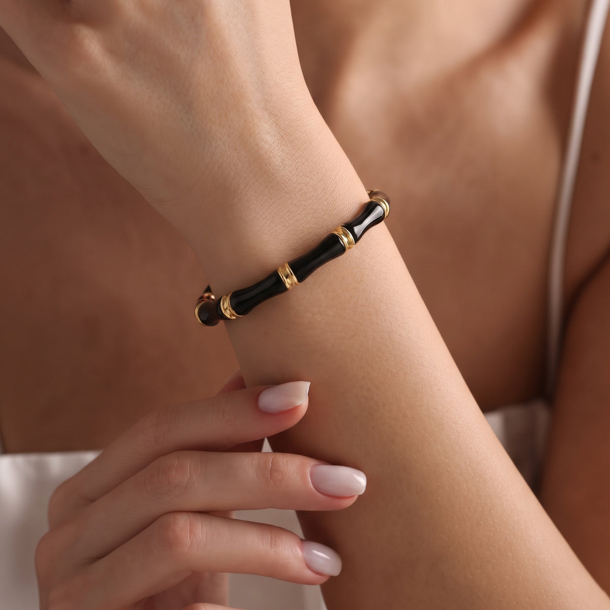 Black Enamel Bamboo Bangle, worn on the wrist