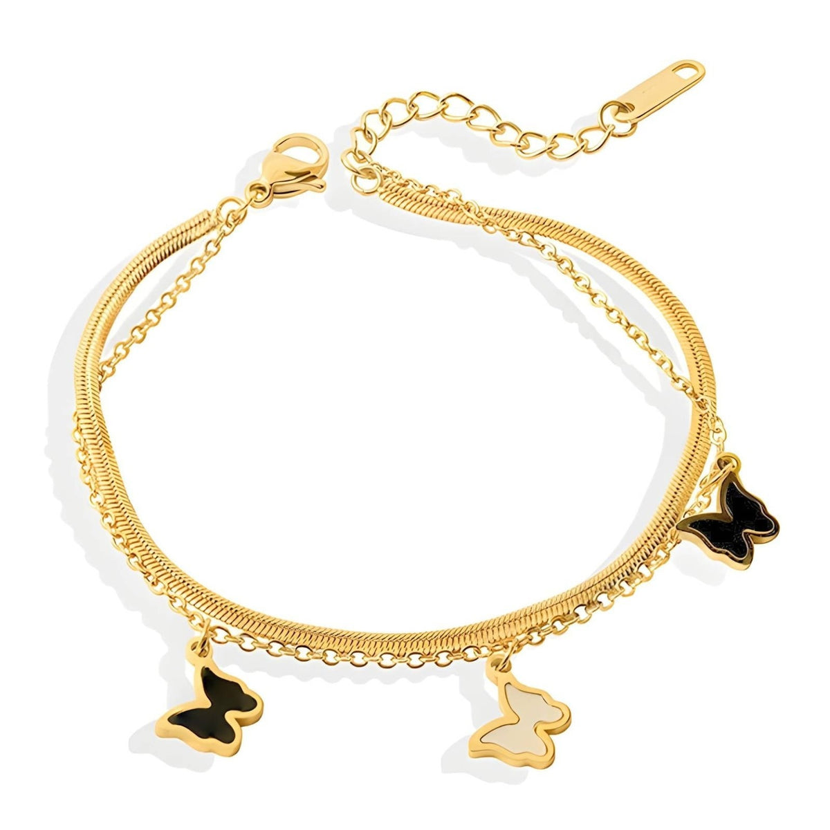 Butterfly Layered Charm Bracelet: layered gold-tone chains with black and white butterfly charms, on white