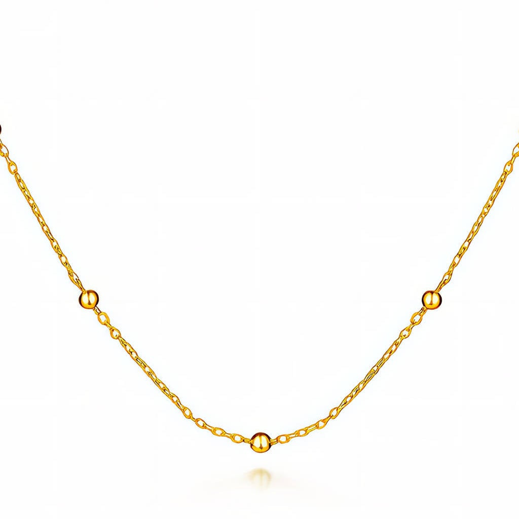 Dainty Beaded Satellite Chain: fine gold-tone chain with small beads, close-up on white