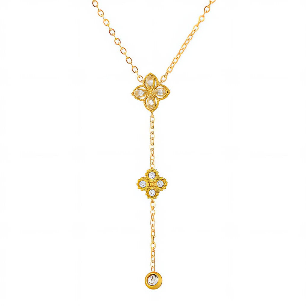 Flower Lariat Necklace: Y-shaped gold-tone chain with two flower charms, close-up on white