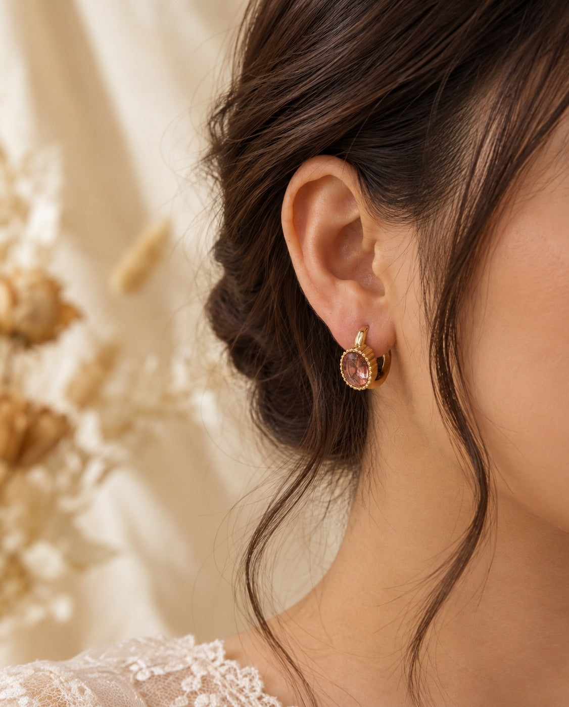 Lilac Crystal Huggie Hoops, worn on the ear