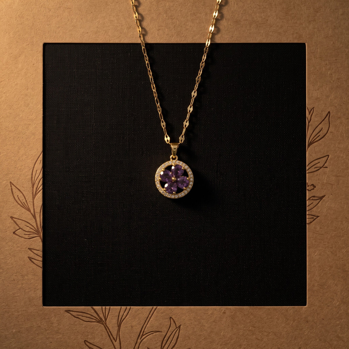Purple flower halo pendant necklace, styled flat lay