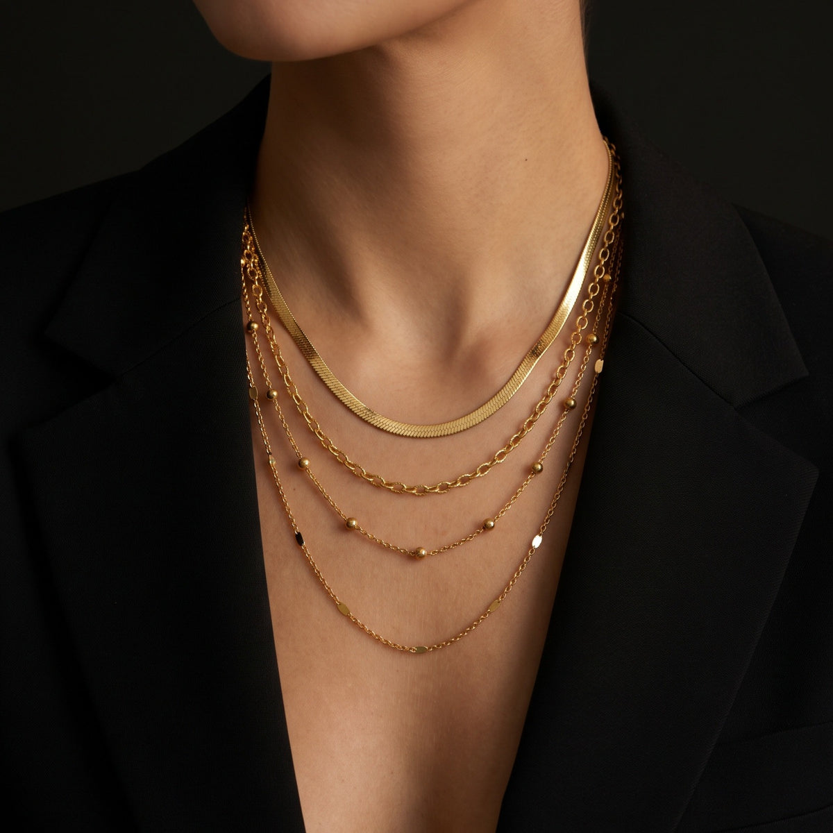 Triple layer herringbone necklace, worn